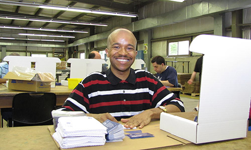 img-Jeffrey-working-and-smiling-in-workshop